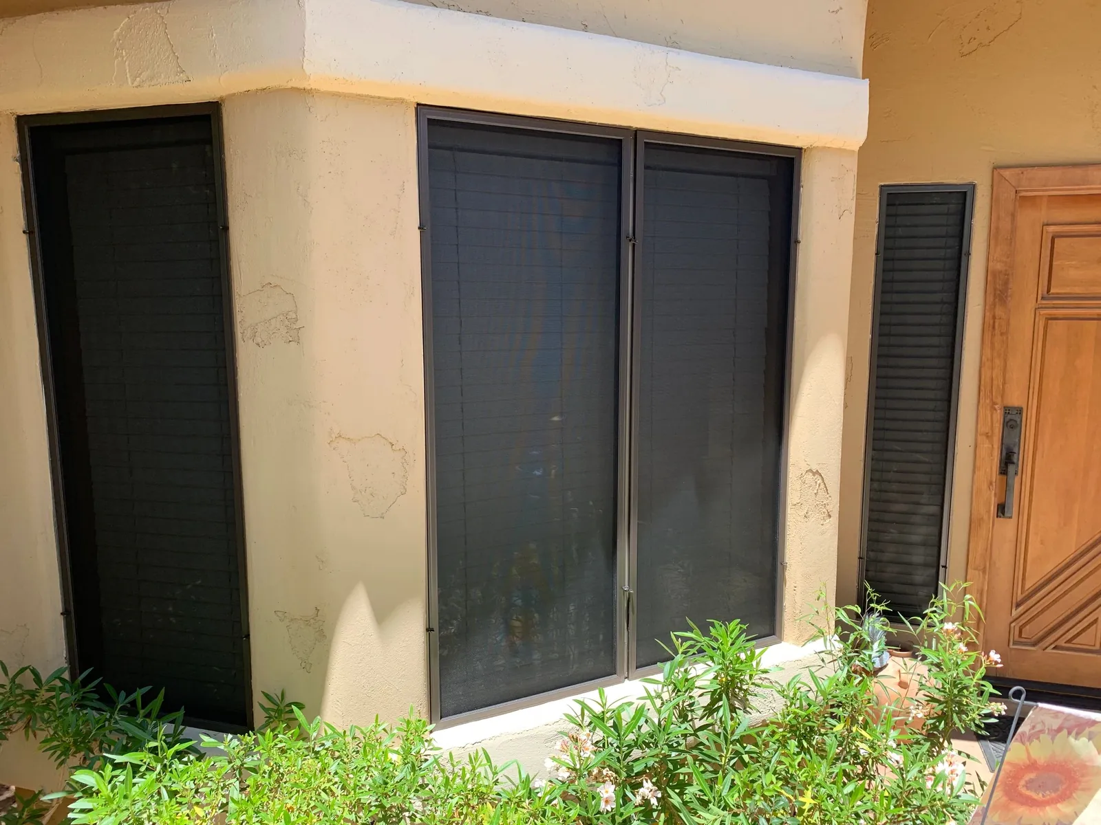 Paired exterior window screens from Arizona Screen Techs’ project library.